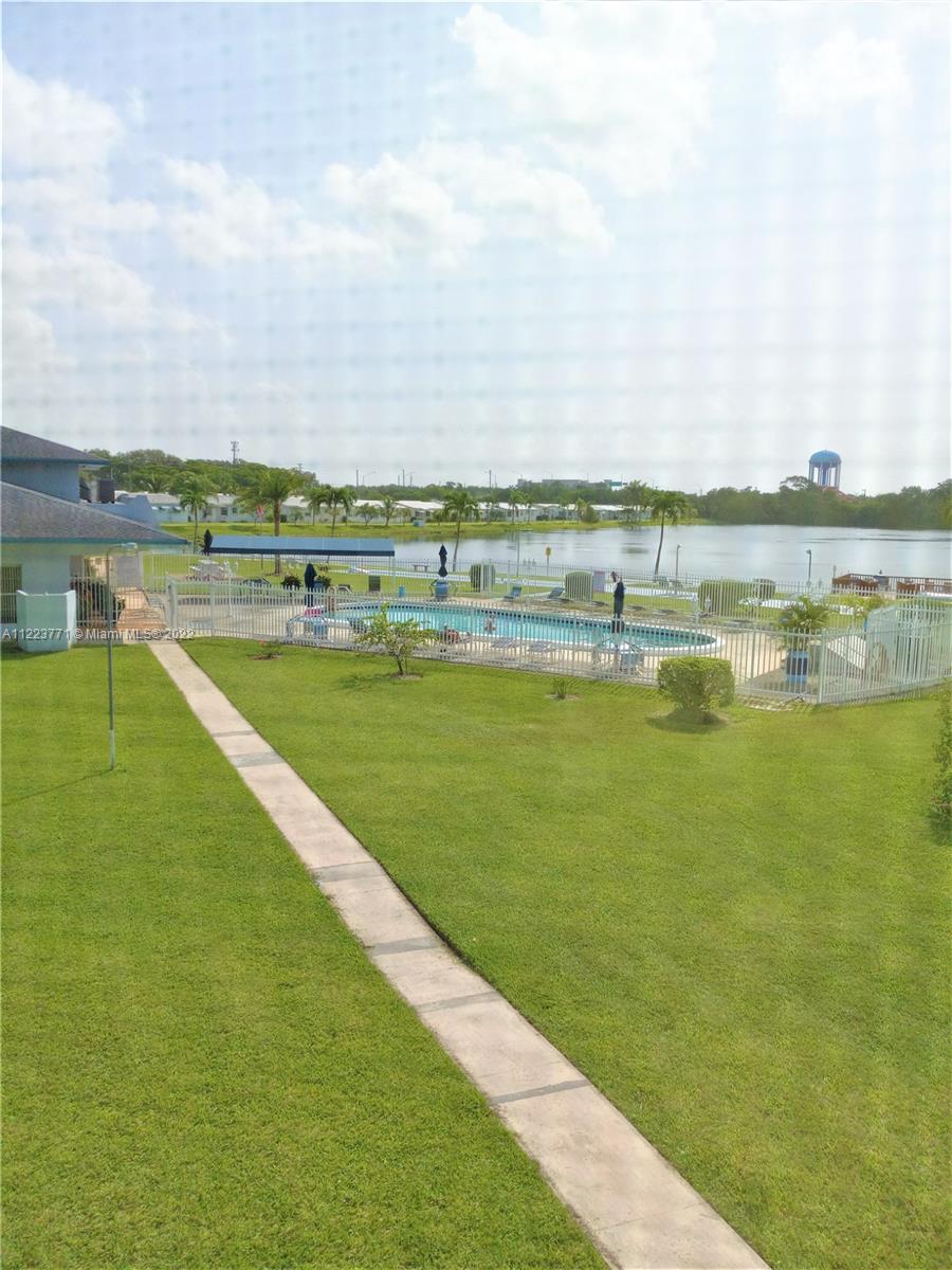 2223 Park Lane, Unit 211 Hollywood, FL 33021 - Photo 16 of 21 a view of a lake with a city