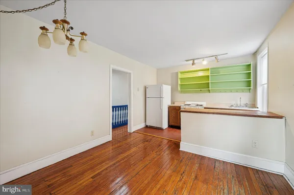 a view of kitchen with empty space and window