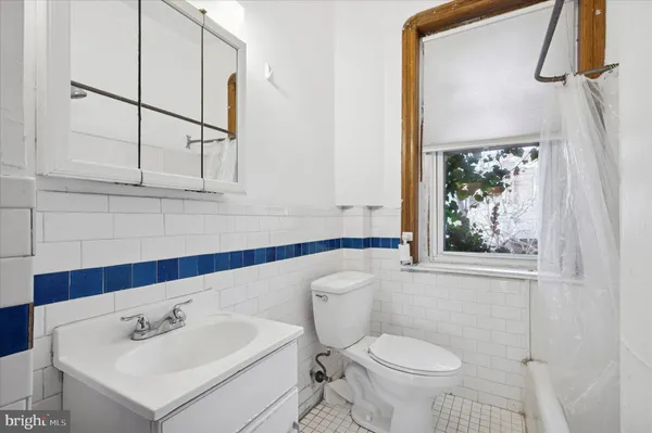 a bathroom with a sink toilet and vanity