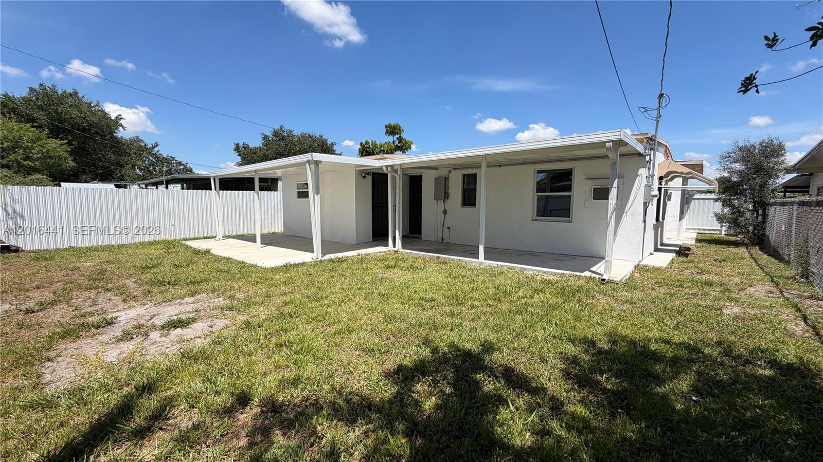 2230 Service Road Opa-Locka, FL 33054 - Photo 23 of 25 a view of a house with a yard