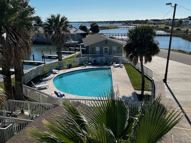 2290 North Fulton Beach Road, Unit B317 Rockport, TX 78382 - Photo 36 of 40 a view of a house with pool and sitting area