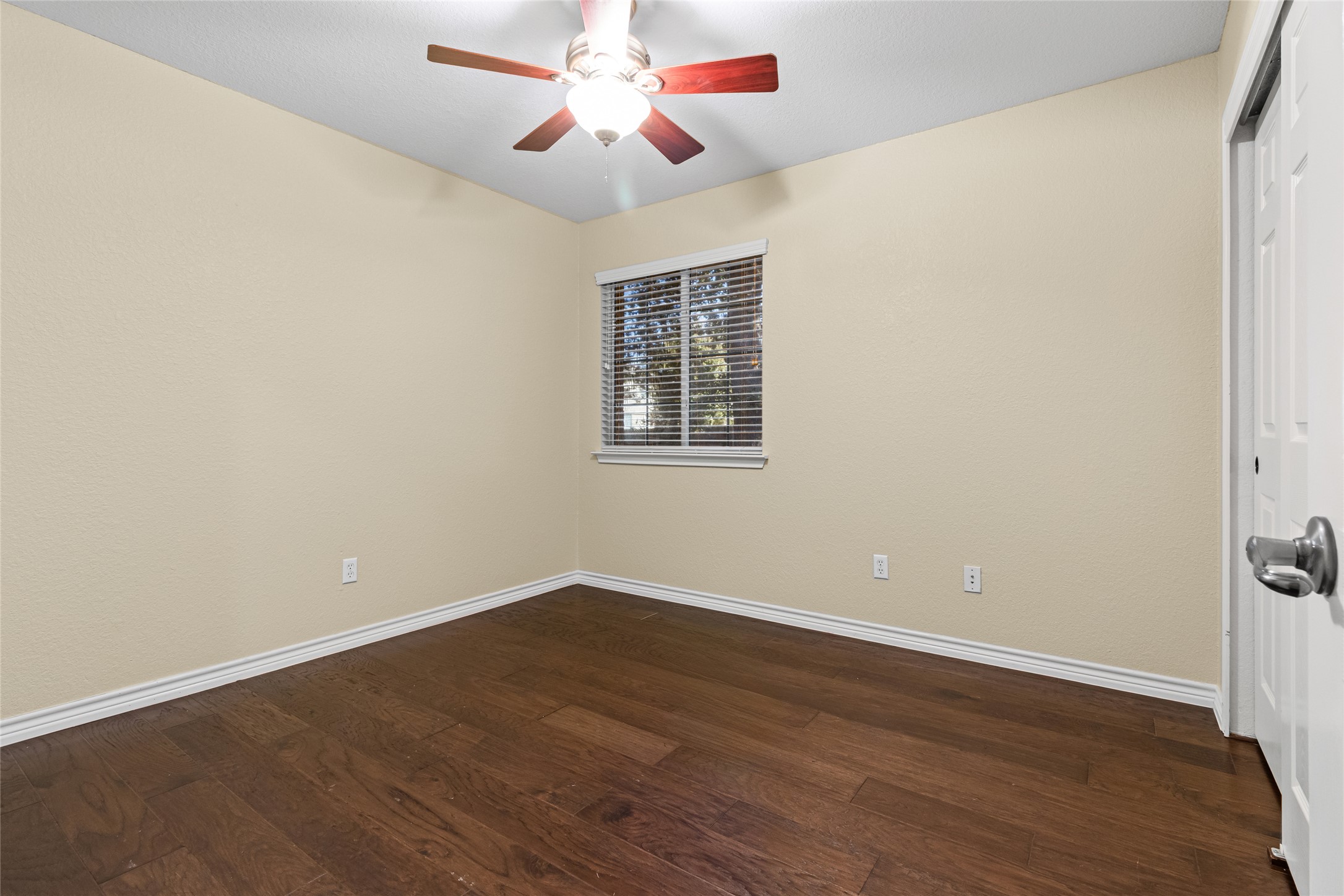 14901 Staked Plains Loop Austin, TX 78717 - Photo 21 of 30 Bedroom with a closet, wood floors, and ceiling fan