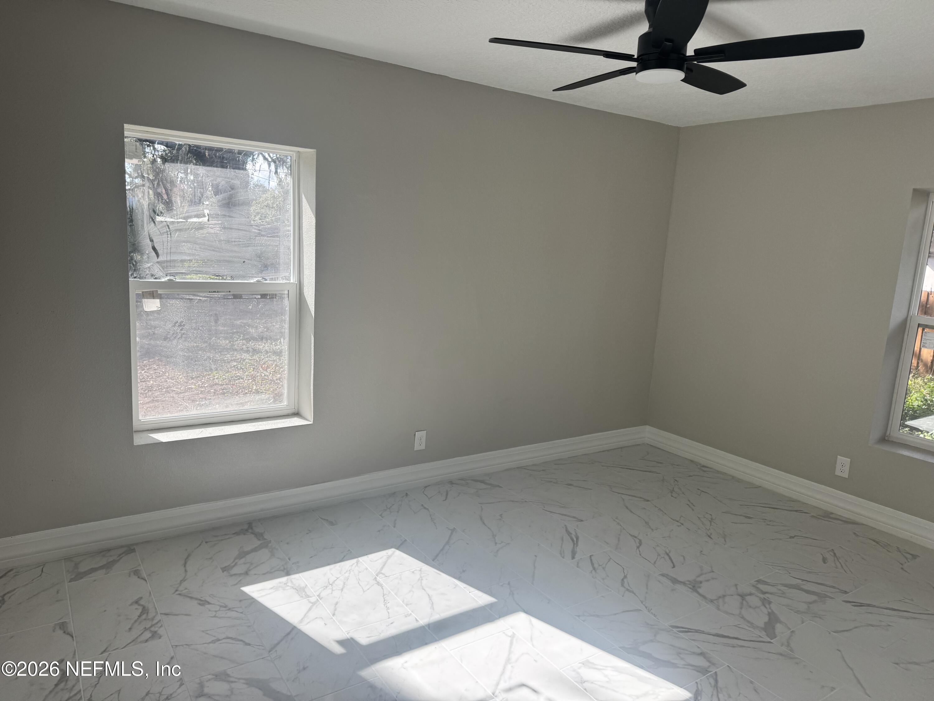 1718 Cornell Road Jacksonville, FL 32207 - Photo 19 of 35 an empty room with a window