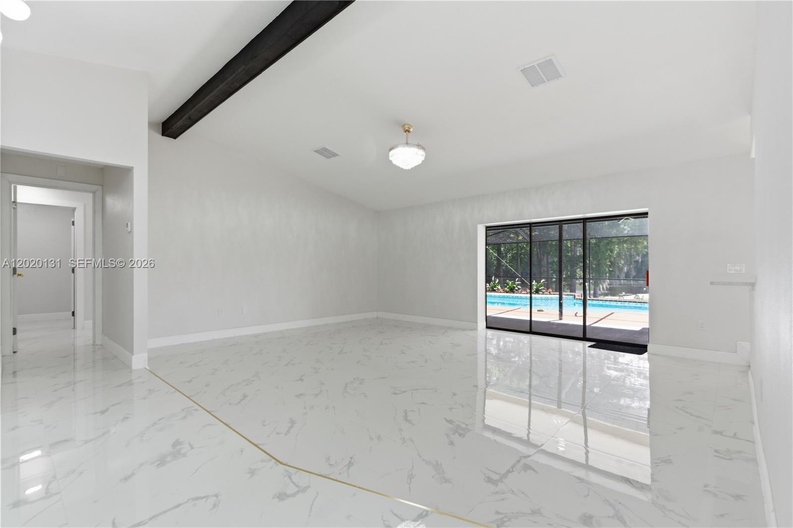 13408 Whitby Road Hudson, FL 34667 - Photo 14 of 30 an empty room with windows and tub