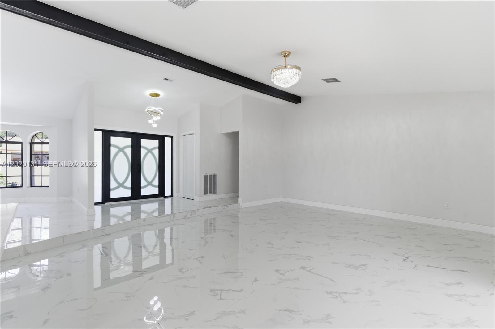 13408 Whitby Road Hudson, FL 34667 - Photo 2 of 30 en empty room with windows