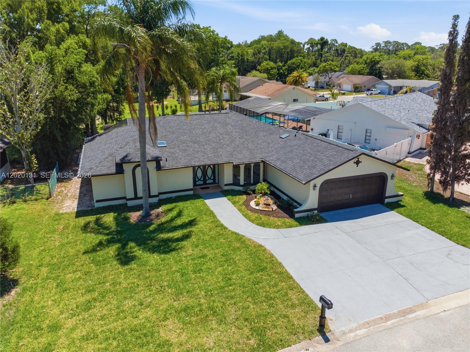 13408 Whitby Road Hudson, FL 34667 - Photo 27 of 30 an aerial view of a house with swimming pool garden and patio