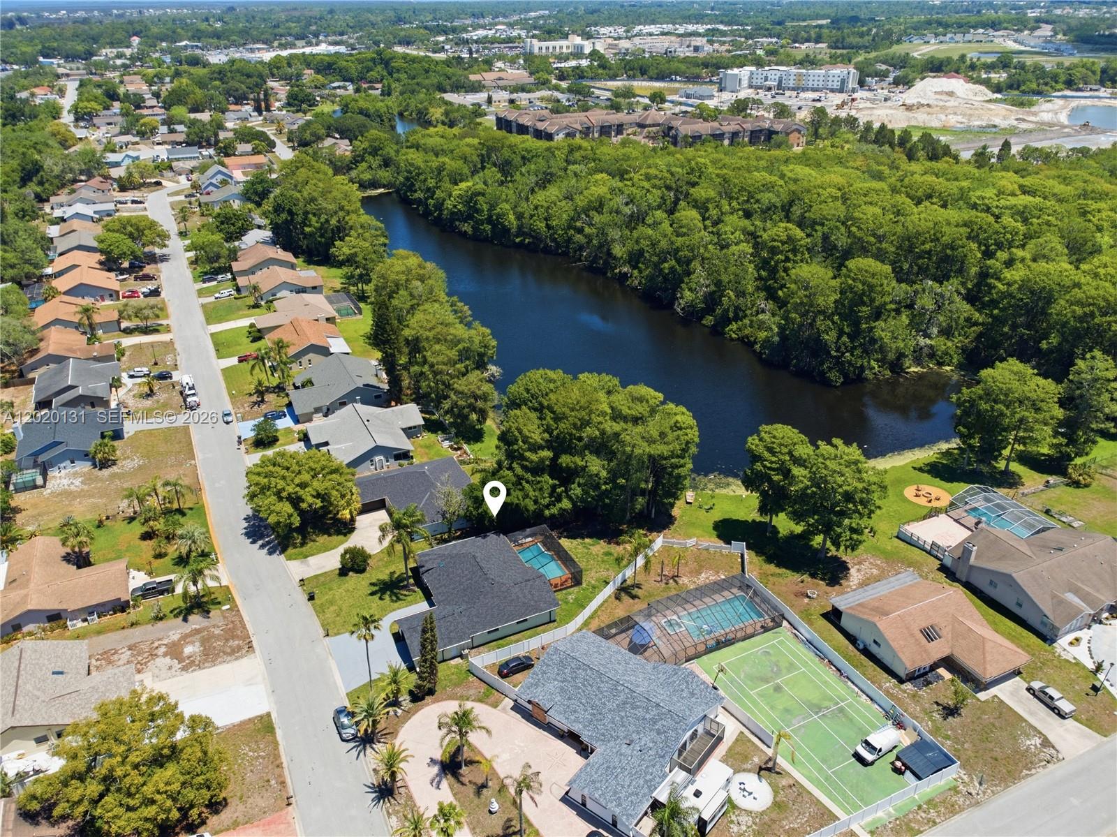 13408 Whitby Road Hudson, FL 34667 - Photo 30 of 30 an aerial view of residential house with outdoor space and swimming pool