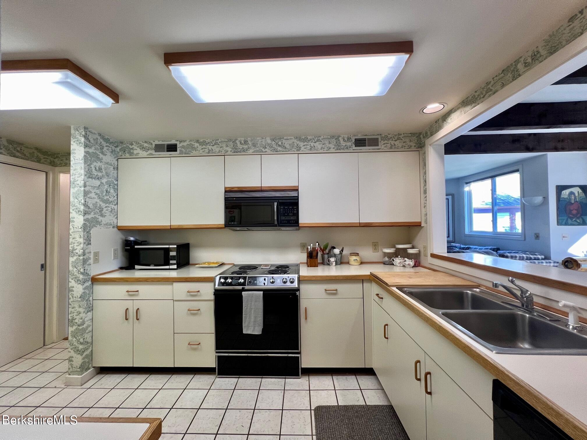 19 Hawthorne Road, Unit S2C Stockbridge, MA 01262 - Photo 19 of 41 a kitchen with a sink stove top oven and cabinets