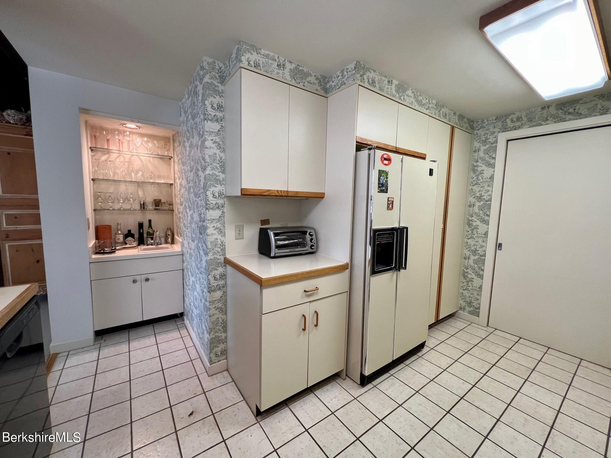 19 Hawthorne Road, Unit S2C Stockbridge, MA 01262 - Photo 21 of 41 a kitchen with a cabinets and white appliances