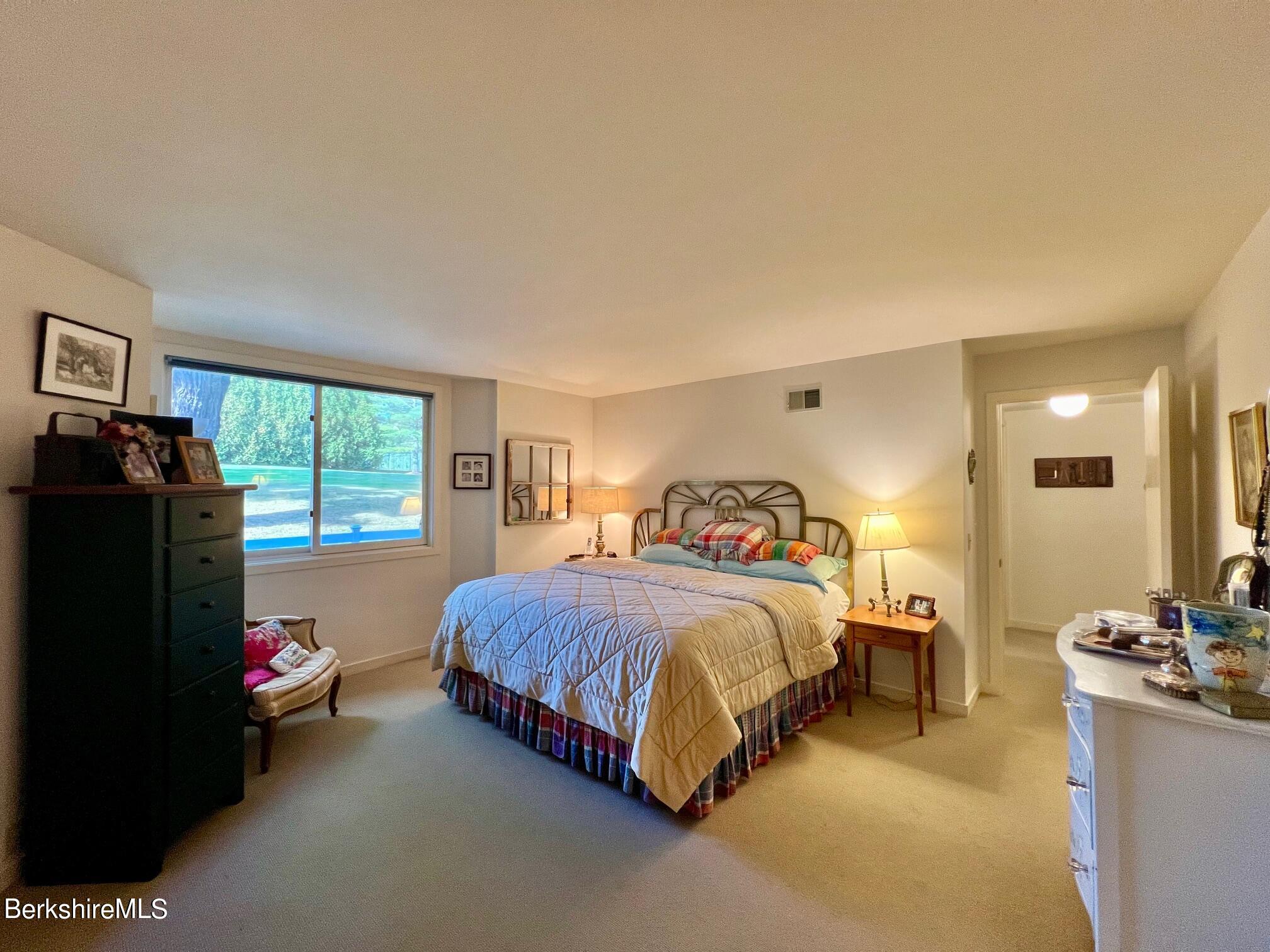 19 Hawthorne Road, Unit S2C Stockbridge, MA 01262 - Photo 22 of 41 a bedroom with a bed and large windows