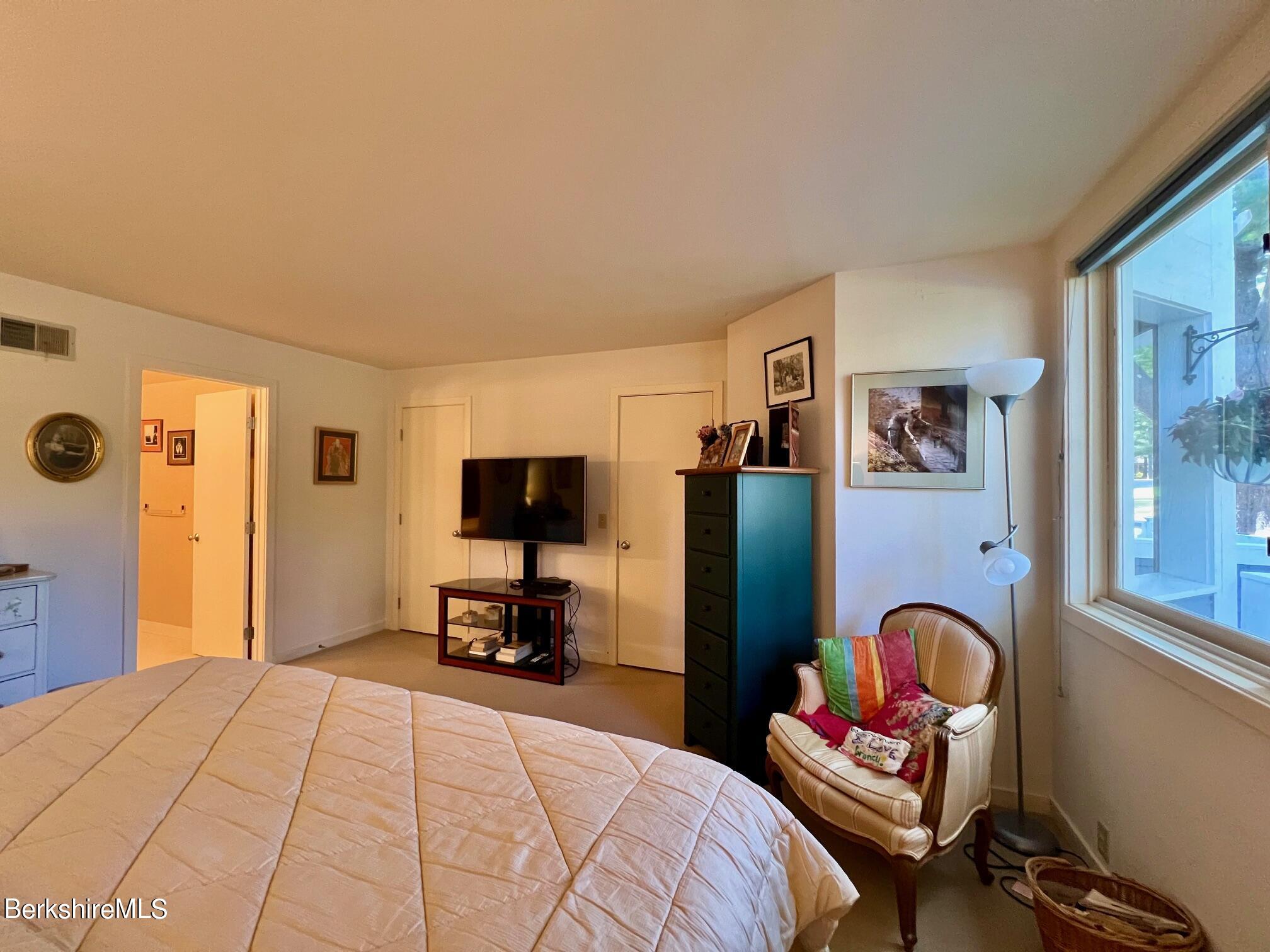 19 Hawthorne Road, Unit S2C Stockbridge, MA 01262 - Photo 24 of 41 a bedroom with a bed chair and a large window