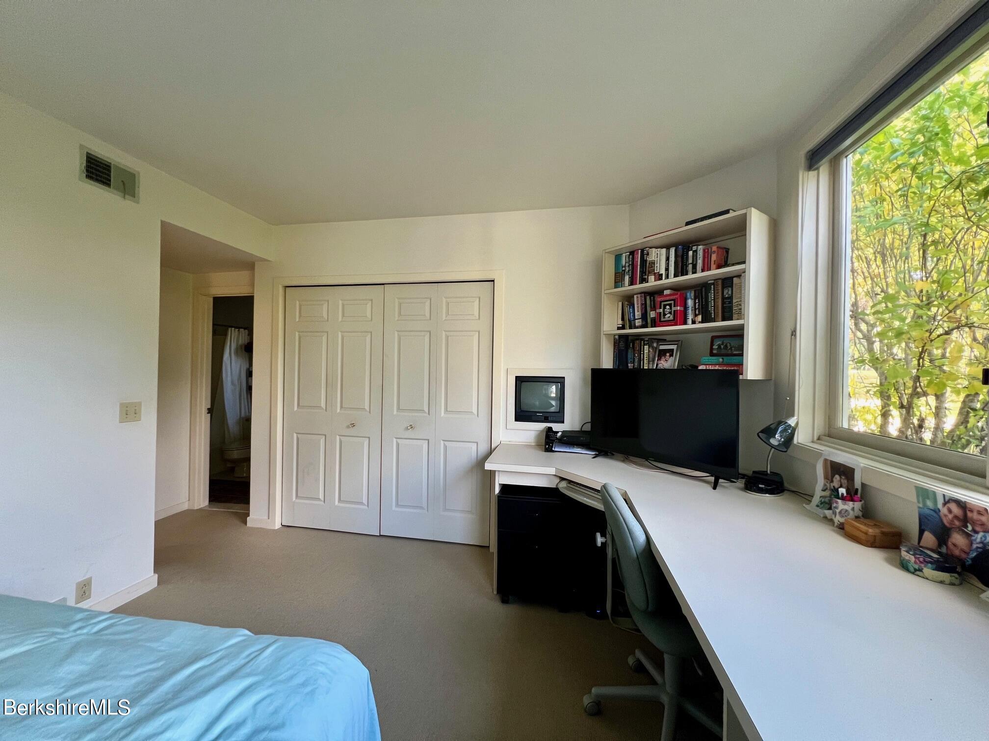 19 Hawthorne Road, Unit S2C Stockbridge, MA 01262 - Photo 29 of 41 a bedroom with a bed and a window