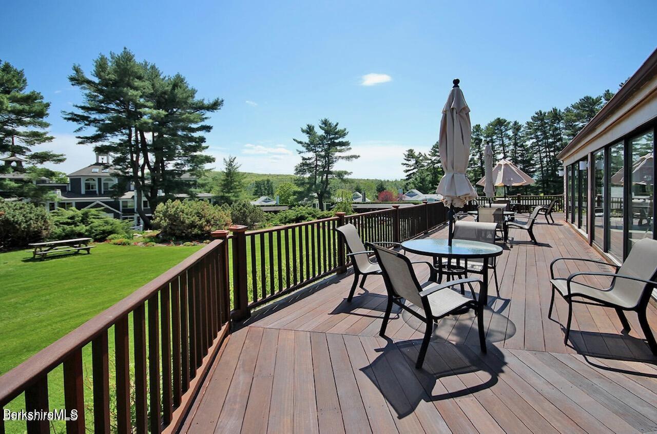 19 Hawthorne Road, Unit S2C Stockbridge, MA 01262 - Photo 36 of 41 a view of a chairs and table on the deck