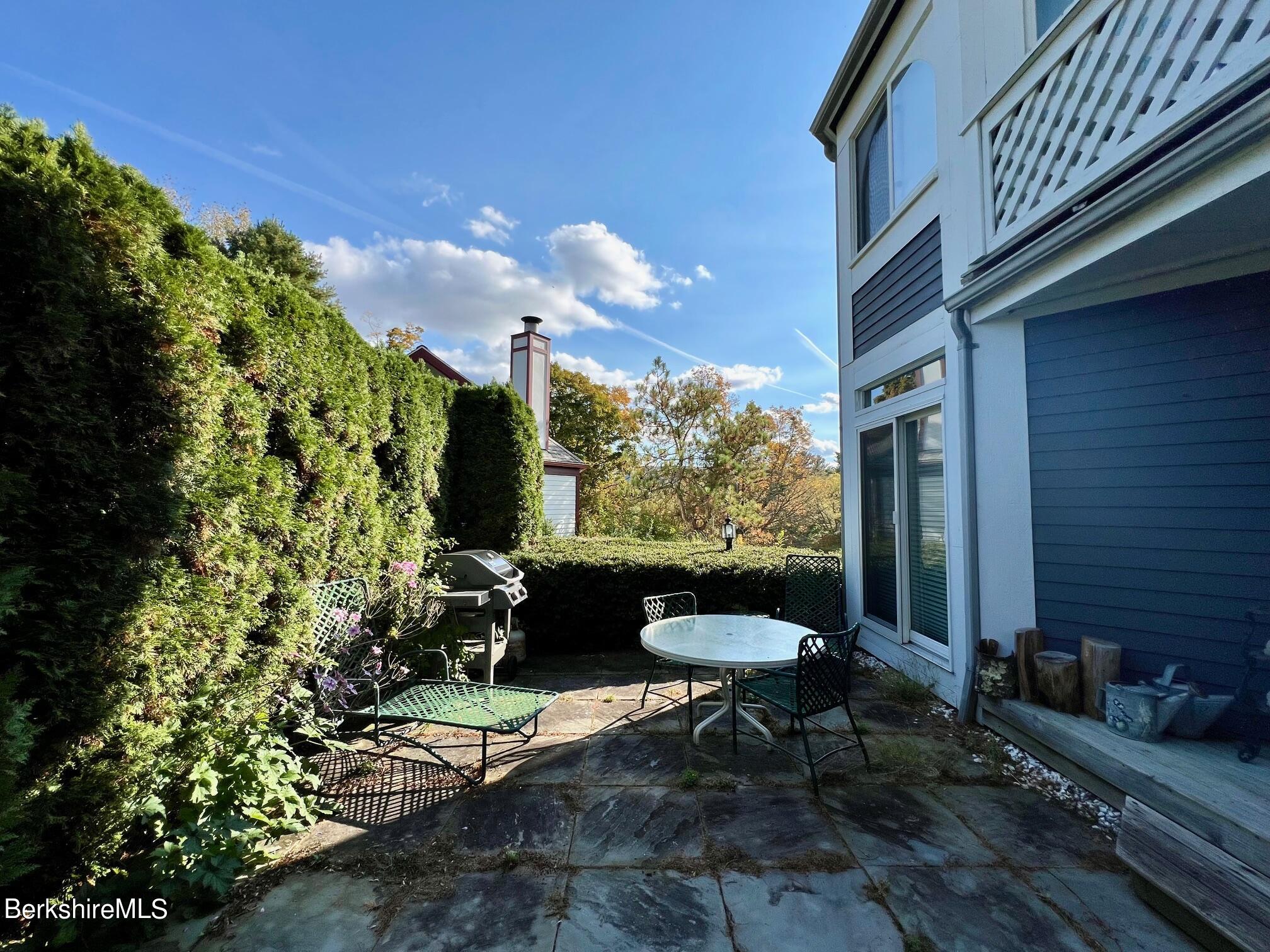 19 Hawthorne Road, Unit S2C Stockbridge, MA 01262 - Photo 4 of 41 a backyard of a house with outdoor seating