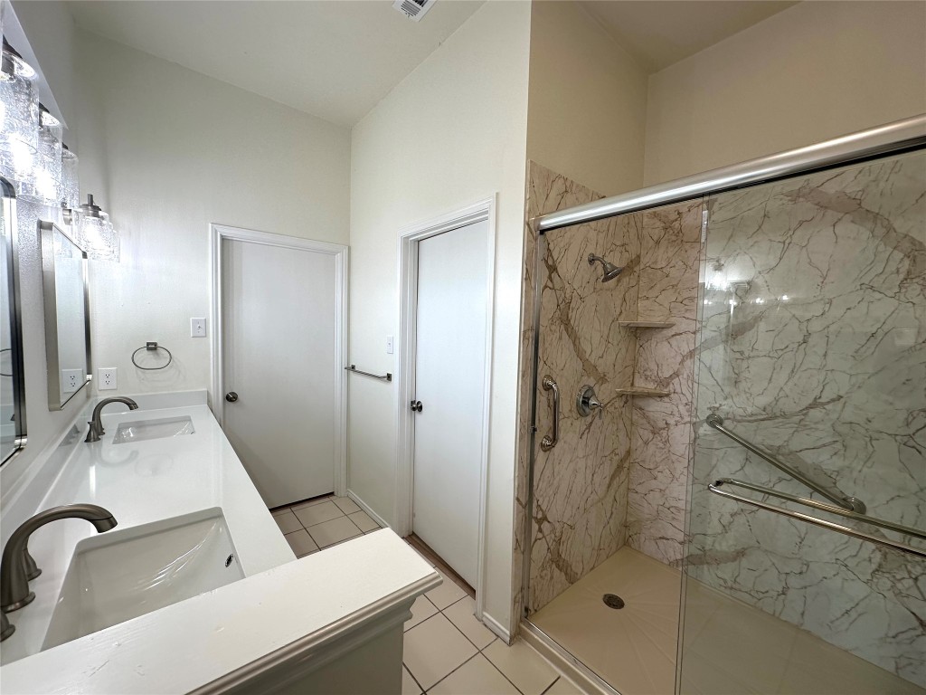 2105 Cervin Boulevard Austin, TX 78728 - Photo 13 of 22 a bathroom with a sink and shower