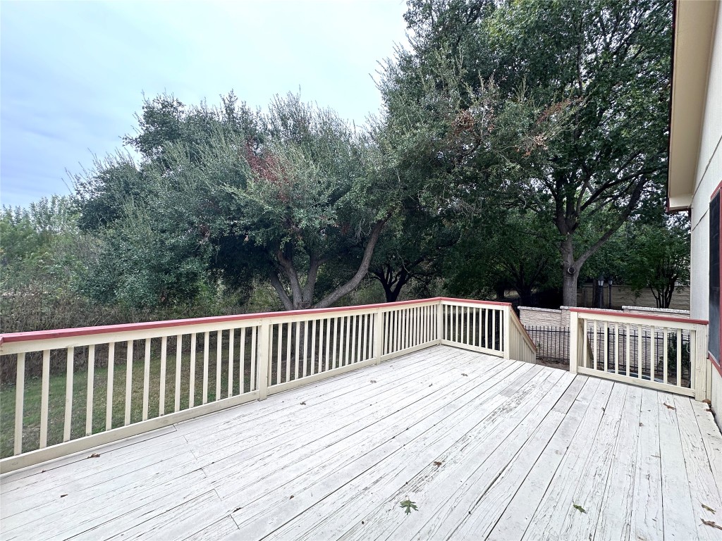 2105 Cervin Boulevard Austin, TX 78728 - Photo 18 of 22 a balcony with wooden floor and fence