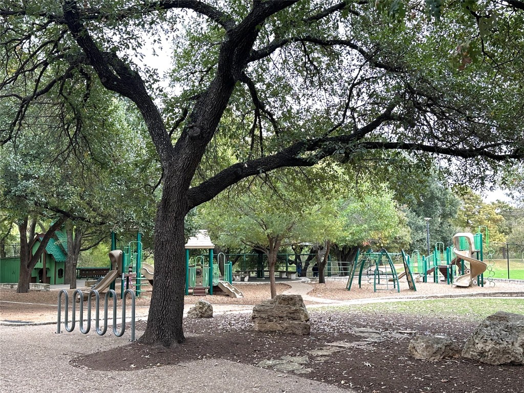 2105 Cervin Boulevard Austin, TX 78728 - Photo 20 of 22 a view of a street with a bench and trees