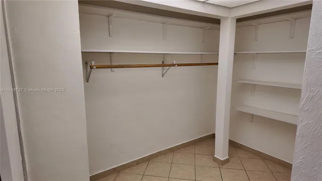 a view of an empty walk in closet