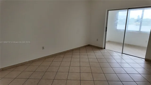 a view of an empty room and window