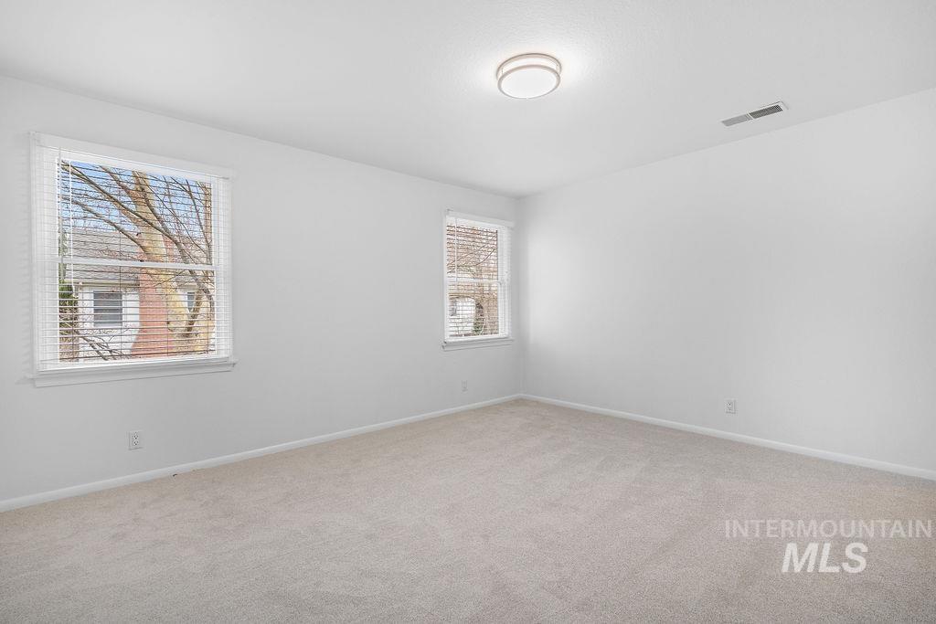 1561 Lenz Lane Boise, ID 83712 - Photo 12 of 29 Unfurnished room featuring carpet flooring and baseboards