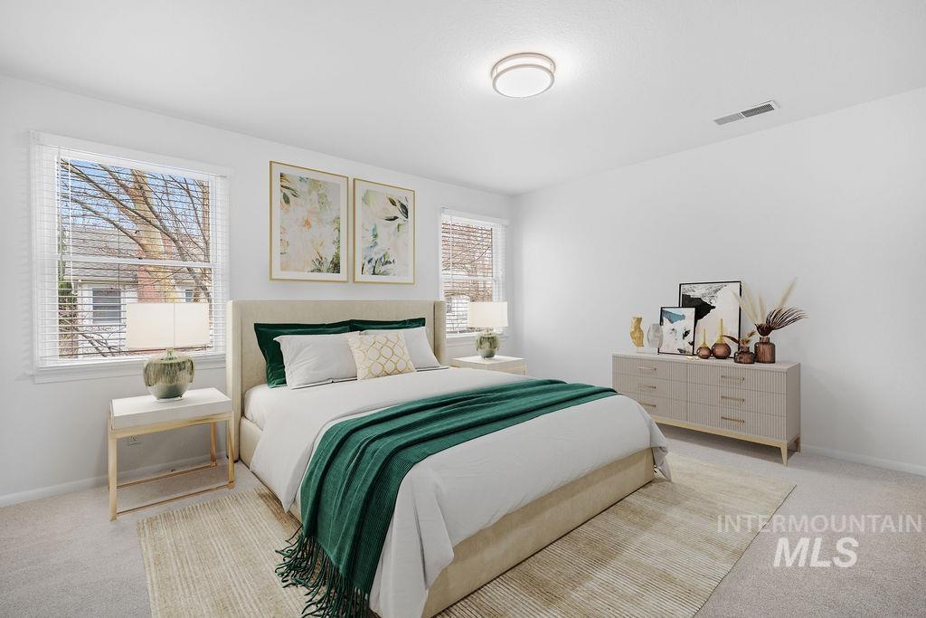 1561 Lenz Lane Boise, ID 83712 - Photo 13 of 29 Bedroom with light colored carpet