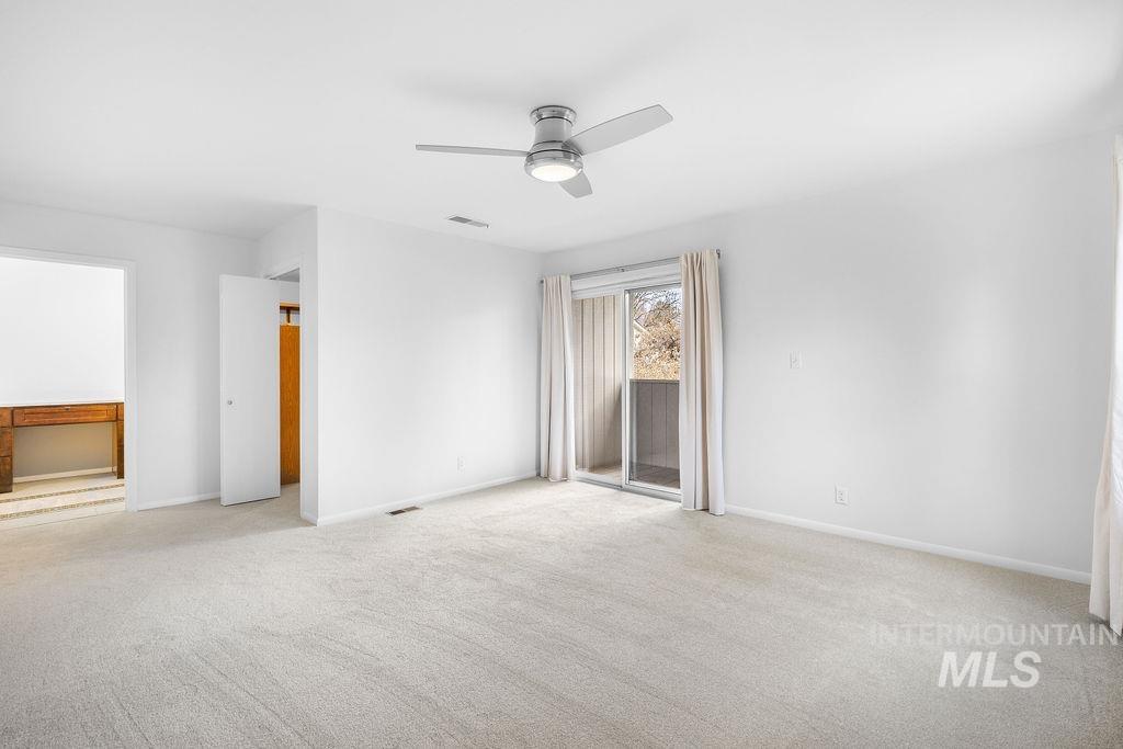 1561 Lenz Lane Boise, ID 83712 - Photo 17 of 29 Spare room featuring ceiling fan and light carpet