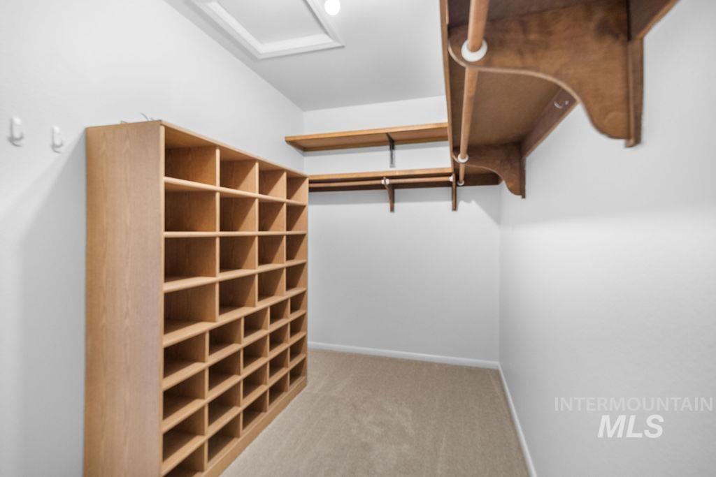 1561 Lenz Lane Boise, ID 83712 - Photo 19 of 29 Walk in closet featuring light carpet and attic access