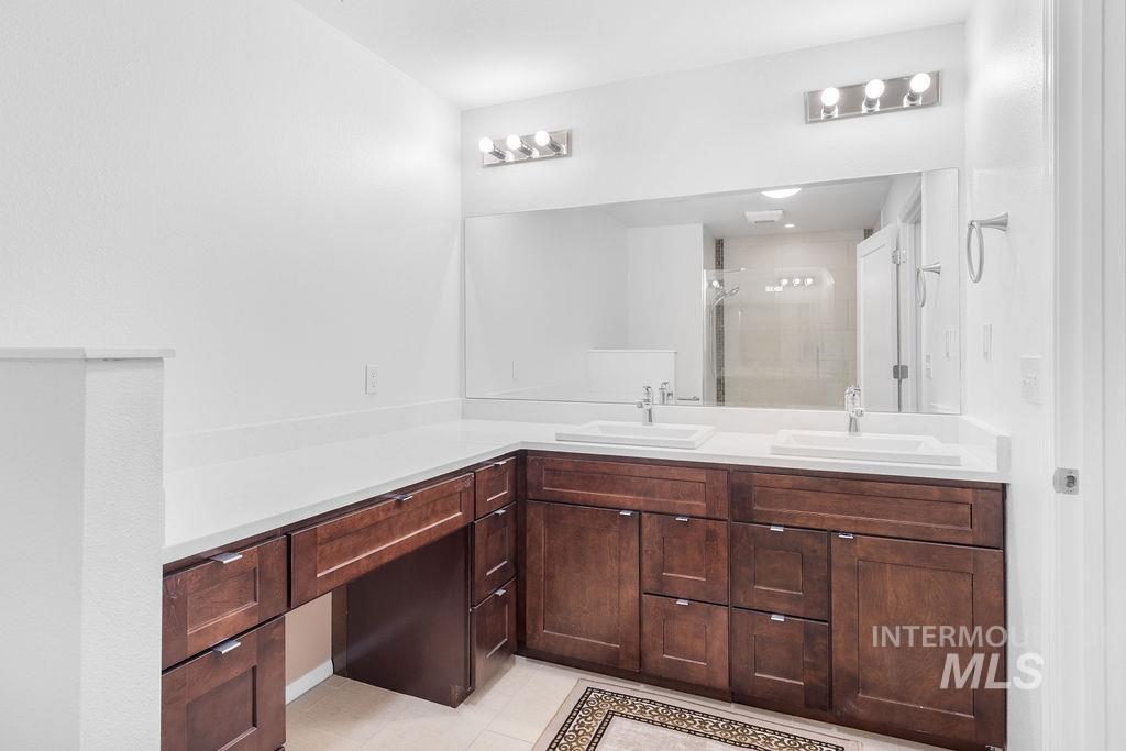 1561 Lenz Lane Boise, ID 83712 - Photo 21 of 29 Bathroom featuring double vanity and a shower stall