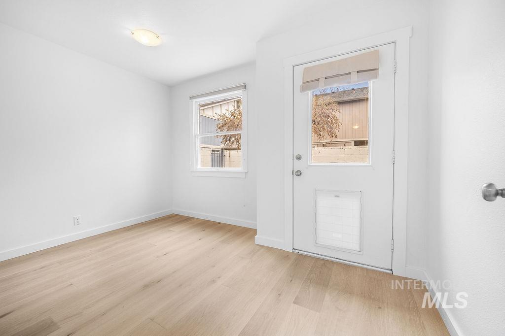 1561 Lenz Lane Boise, ID 83712 - Photo 9 of 29 Entryway featuring baseboards and wood finished floors