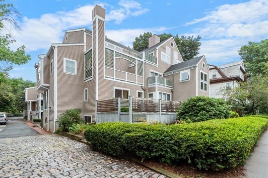front view of a house with a garden