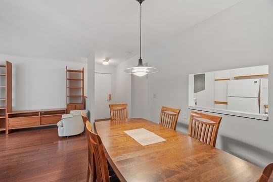 28 Alton Place, Unit A Brookline, MA 02446 - Photo 12 of 23 a bedroom with furniture and wooden floor