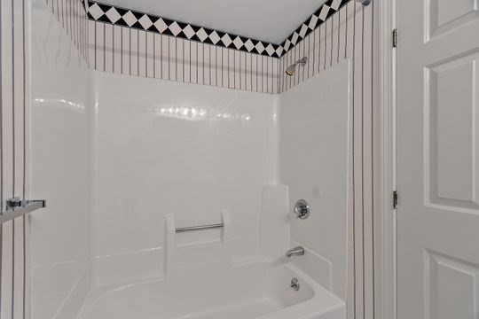 28 Alton Place, Unit A Brookline, MA 02446 - Photo 13 of 23 a bathroom with a bathtub and a shower