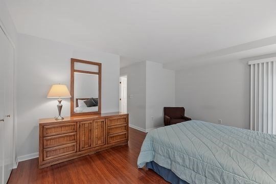 28 Alton Place, Unit A Brookline, MA 02446 - Photo 14 of 23 a bedroom with a bed and a dresser