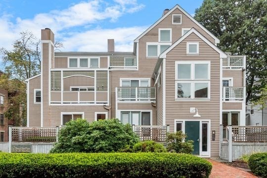 28 Alton Place, Unit A Brookline, MA 02446 - Photo 2 of 23 a front view of a house with a yard