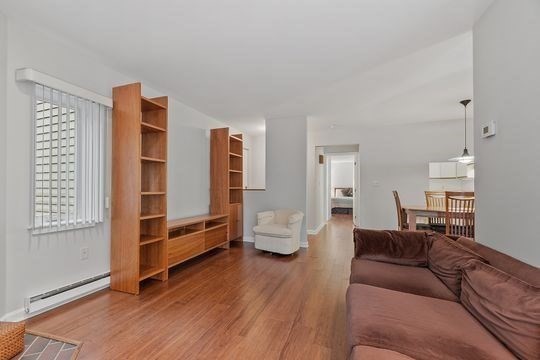 28 Alton Place, Unit A Brookline, MA 02446 - Photo 9 of 23 a living room with furniture and wooden floor