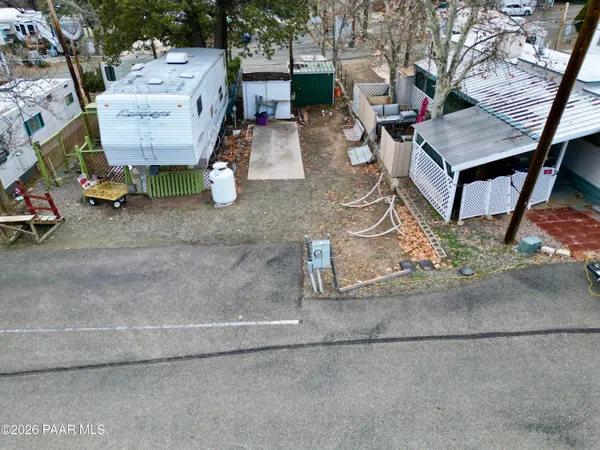 a view of a backyard with sitting area