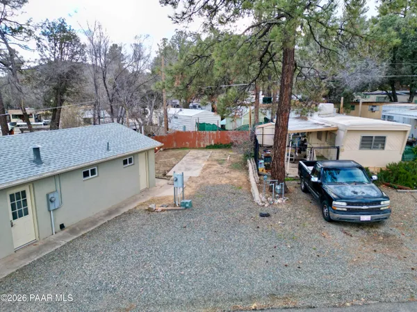 an aerial view of a house with outdoor space