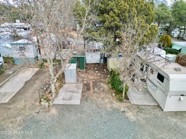 an aerial view of a yard with table and chairs