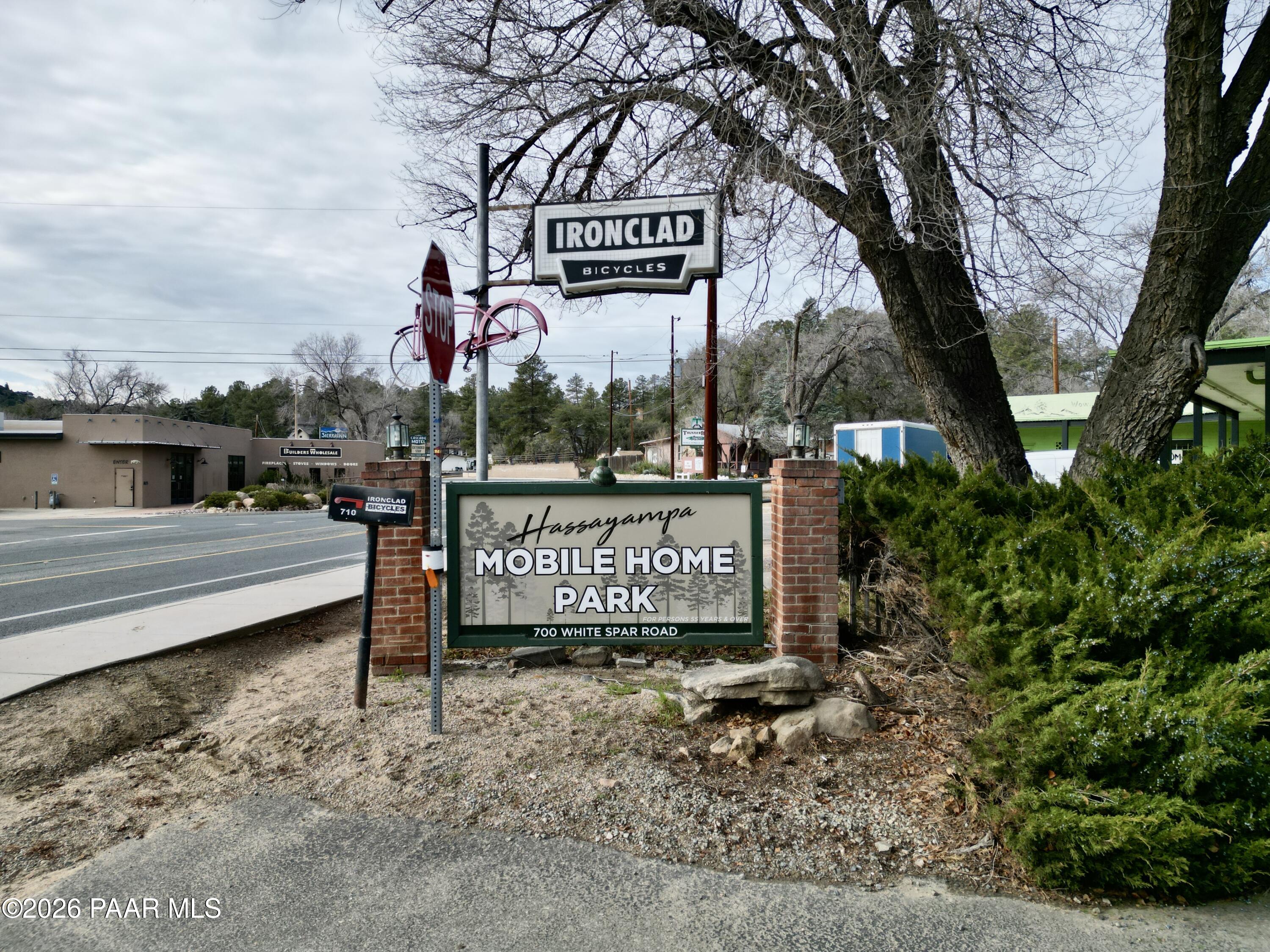 700 White Spar Road Prescott, AZ 86303 - Photo 3 of 87 a view of a street sign under a large tree