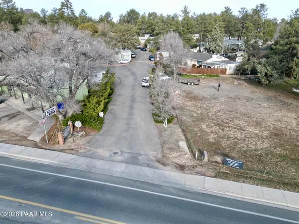 an aerial view of multiple houses with yard