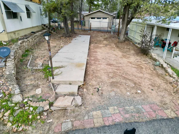an aerial view of a residential houses with outdoor space