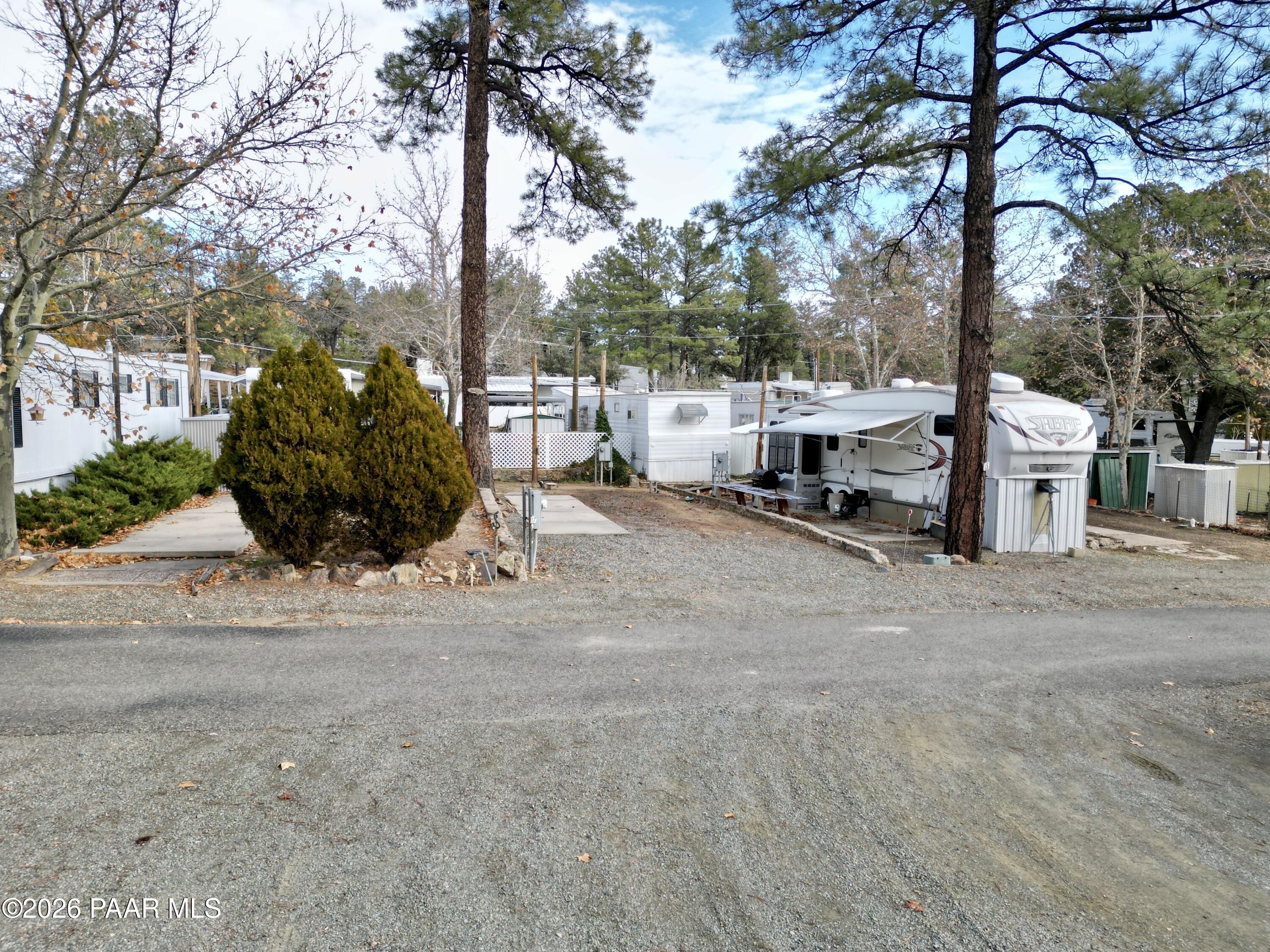 700 White Spar Road Prescott, AZ 86303 - Photo 63 of 87 a view of a street with a bench and trees