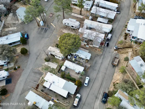 an aerial view of residential houses with outdoor space