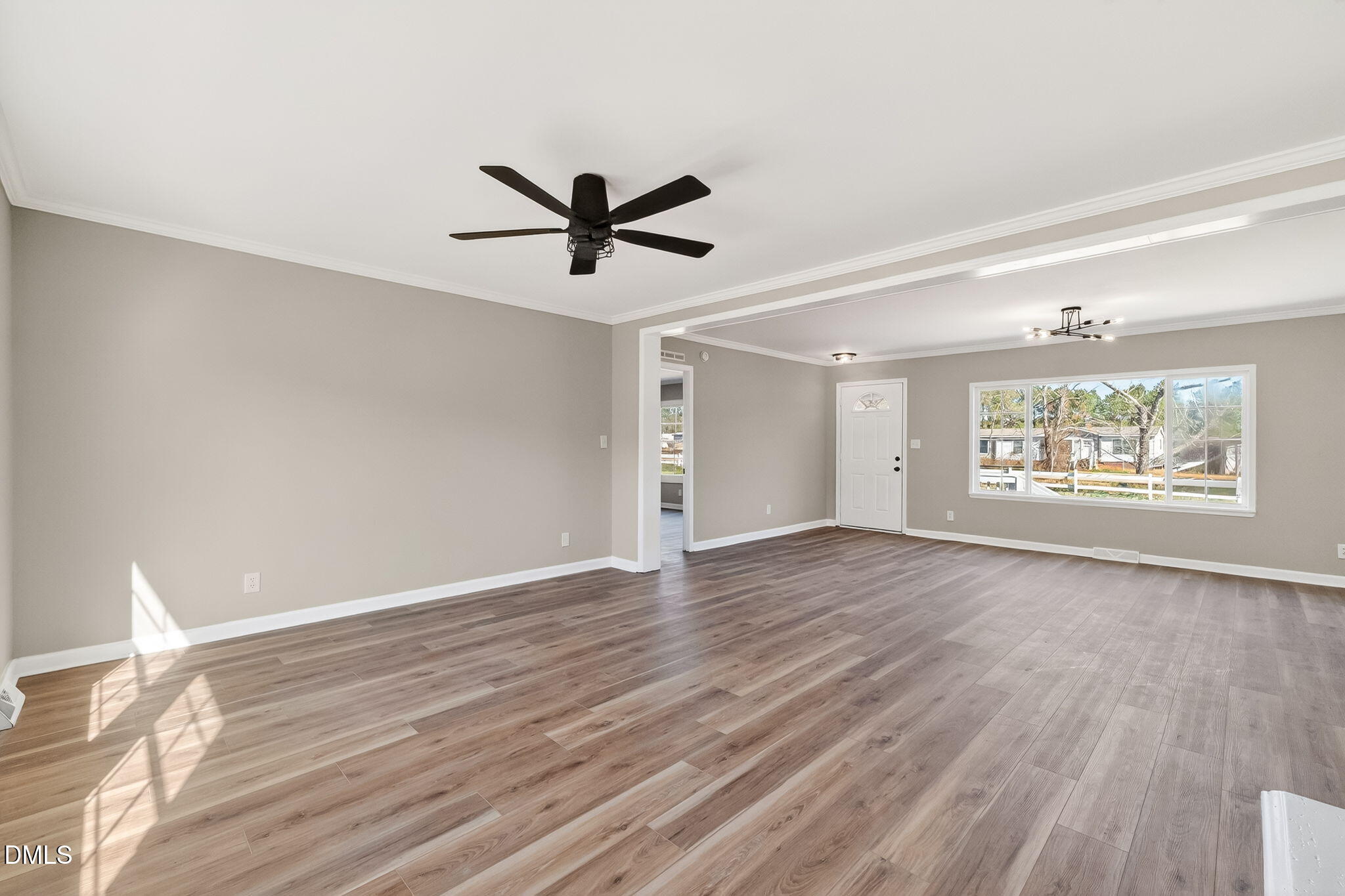 10015 Smith Road Middlesex, NC 27557 - Photo 11 of 48 a view of an empty room with wooden floor and a window