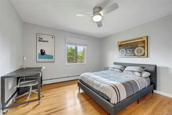 a bedroom with a bed and a desk