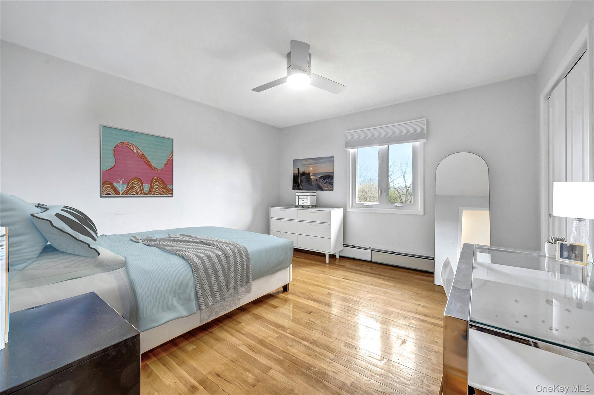 33 Hirst Road Briarcliff Manor, NY 10510 - Photo 14 of 25 a spacious bedroom with a bed a dresser and windows