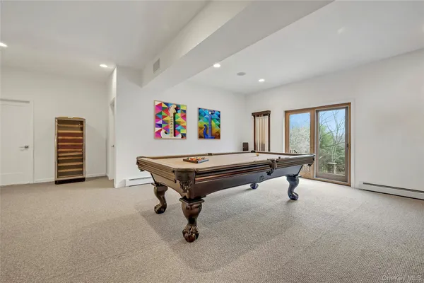 a room with furniture and air hockey table