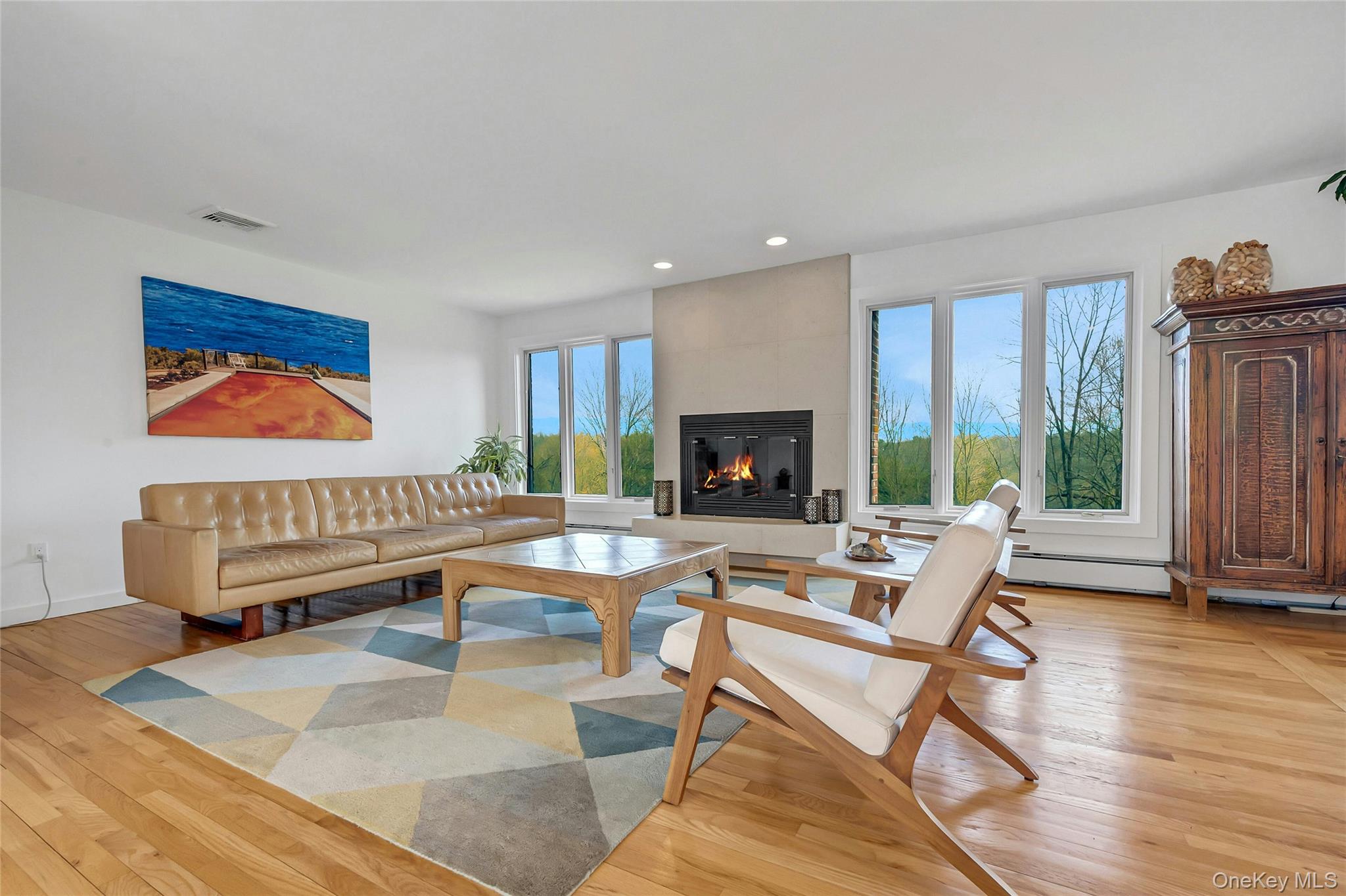 33 Hirst Road Briarcliff Manor, NY 10510 - Photo 3 of 25 a living room with furniture a flat screen tv and a fireplace
