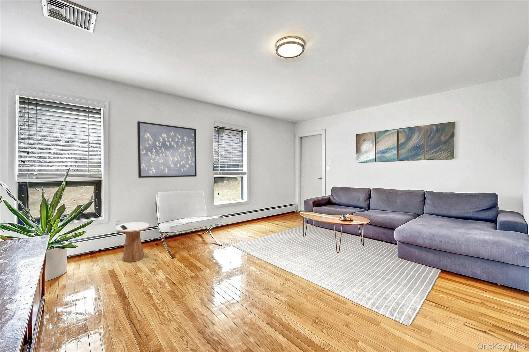 33 Hirst Road Briarcliff Manor, NY 10510 - Photo 8 of 25 a living room with furniture and a wooden floor