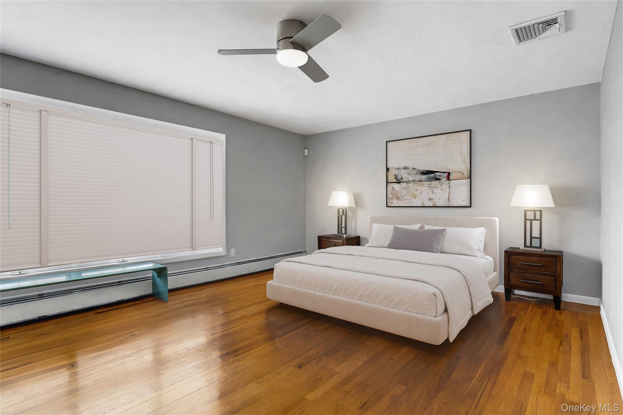 33 Hirst Road Briarcliff Manor, NY 10510 - Photo 10 of 25 a bedroom with a bed and a ceiling fan
